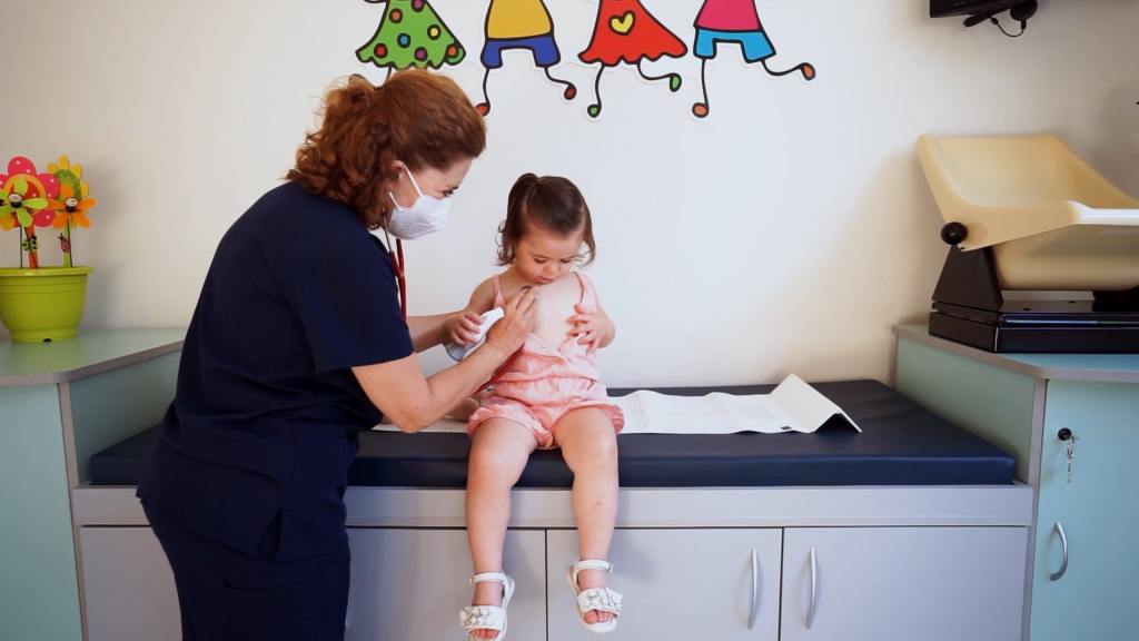 child being examined by doctor